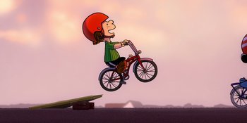 Movie still from “Snoopy Presents: Lucy's School” (2022), directed by Raymond S. Persi – A person on a bicycle doing a trick in the air; Wide shot, Overhead angle
