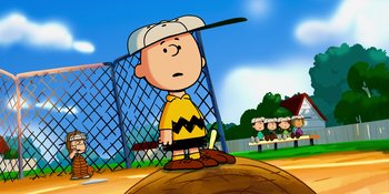 Movie still from “Snoopy Presents: Lucy's School” (2022), directed by Raymond S. Persi – A charlie brown baseball player is standing on a base; Wide shot, High angle