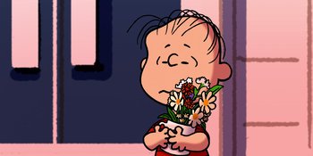 Movie still from “Snoopy Presents: Lucy's School” (2022), directed by Raymond S. Persi – A boy holding a vase with flowers in it; Close Up shot, High angle