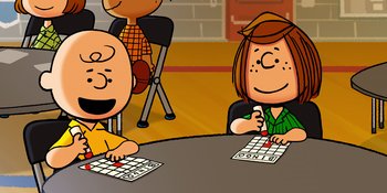Movie still from “Snoopy Presents: Lucy's School” (2022), directed by Raymond S. Persi – Two people sitting at a table playing a board game; Medium shot, High angle