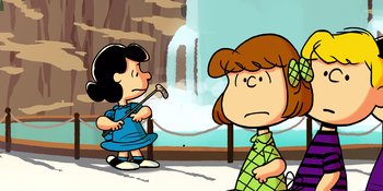 Movie still from “Snoopy Presents: Lucy's School” (2022), directed by Raymond S. Persi – A cartoon of a woman and a girl in front of a fountain; Extreme Wide shot, Low angle