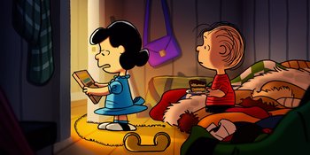 Movie still from “Snoopy Presents: Lucy's School” (2022), directed by Raymond S. Persi – A girl and a boy sitting on the floor with a book; Extreme Wide shot, High angle