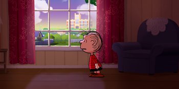 Movie still from “Snoopy Presents: Lucy's School” (2022), directed by Raymond S. Persi – A boy standing in front of a large window; Extreme Wide shot, Over the shoulder angle