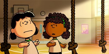 Movie still from “Snoopy Presents: Lucy's School” (2022), directed by Raymond S. Persi – A cartoon picture of a girl with a curly hair style; Medium shot, High angle