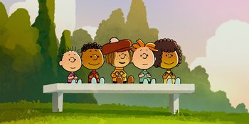Movie still from “Snoopy Presents: One-of-a-Kind Marcie” (2023), directed by Raymond S. Persi – A group of people sitting on top of a bench; Wide shot, Low angle