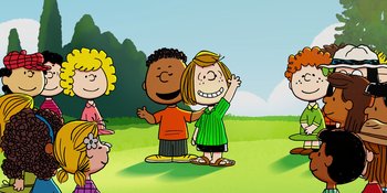 Movie still from “Snoopy Presents: One-of-a-Kind Marcie” (2023), directed by Raymond S. Persi – A group of people standing next to each other on top of a field; Extreme Wide shot, High angle