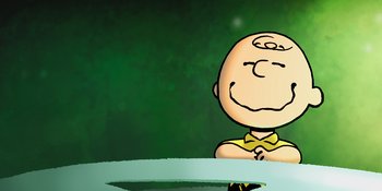 Movie still from “Snoopy Presents: One-of-a-Kind Marcie” (2023), directed by Raymond S. Persi – A drawing of charlie brown sitting at a table; Medium shot, High angle