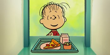 Movie still from “Snoopy Presents: One-of-a-Kind Marcie” (2023), directed by Raymond S. Persi – A boy sitting in front of a tray of food; Medium shot, High angle