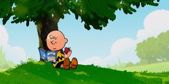 Movie still from “Snoopy Presents: One-of-a-Kind Marcie” (2023), directed by Raymond S. Persi – A charlie brown sitting under a tree with an apple in his hand; Wide shot, Low angle