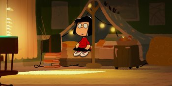Movie still from “Snoopy Presents: One-of-a-Kind Marcie” (2023), directed by Raymond S. Persi – A cartoon picture of a woman sitting on a couch; Wide shot, High angle