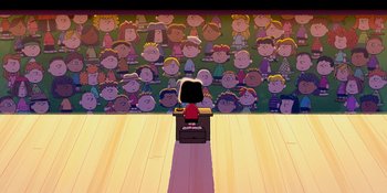 Movie still from “Snoopy Presents: One-of-a-Kind Marcie” (2023), directed by Raymond S. Persi – A computer desk with a computer monitor on top of it; Extreme Wide shot, High angle