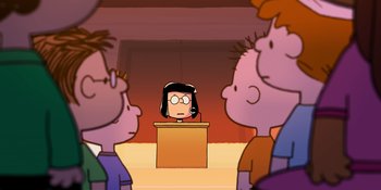 Movie still from “Snoopy Presents: One-of-a-Kind Marcie” (2023), directed by Raymond S. Persi – A group of people standing in front of a podium; Medium shot, High angle