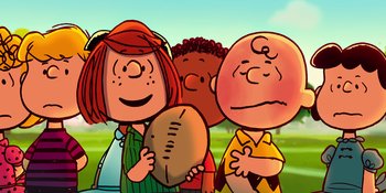 Movie still from “Snoopy Presents: To Mom (and Dad), with Love” (2022), directed by Clay Kaytis – A group of people standing next to each other holding a football; Medium shot, High angle