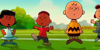 Movie still from “Snoopy Presents: To Mom (and Dad), with Love” (2022), directed by Clay Kaytis – Two cartoon characters are standing in a grassy field; Medium shot, Low angle