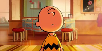 A charlie brown cartoon character in front of a dining room table