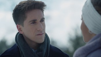 Movie still from “Snow Day” (2022), directed by Michael Lembeck – A person wearing a scarf and a jacket; Close Up shot, Over the shoulder angle