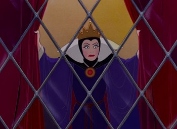 Movie still from “Snow White and the Seven Dwarfs” (1937), directed by Larry Morey – The evil queen is looking through a window; Medium shot, Low angle