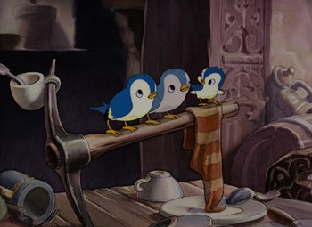 Movie still from “Snow White and the Seven Dwarfs” (1937), directed by Larry Morey – Three blue birds sitting on top of a wooden stick; Medium shot, Low angle