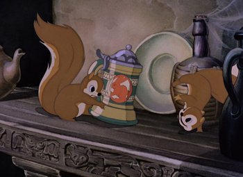 Movie still from “Snow White and the Seven Dwarfs” (1937), directed by Larry Morey – A couple of squirrels are sitting on a shelf; Medium shot, High angle