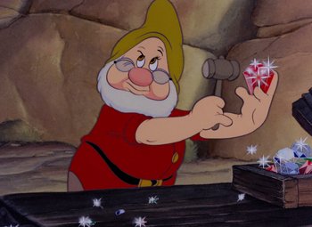 Movie still from “Snow White and the Seven Dwarfs” (1937), directed by Larry Morey – A painting of a gnome holding a hammer; Close Up shot, Over the shoulder angle