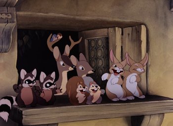 Movie still from “Snow White and the Seven Dwarfs” (1937), directed by Larry Morey – A group of cartoon animals sitting on top of a wooden shelf; Wide shot, High angle