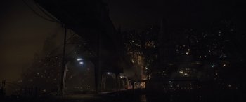 Movie still from “Solo: A Star Wars Story” (2018), directed by Ron Howard – People are walking on a street at night; Extreme Wide shot, High angle