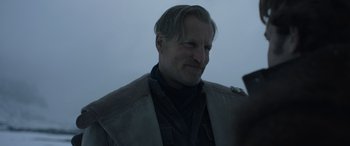 Movie still from “Solo: A Star Wars Story” (2018), directed by Ron Howard – A person wearing a jacket; Close Up shot, Over the shoulder angle