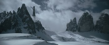 Movie still from “Solo: A Star Wars Story” (2018), directed by Ron Howard – A mountain range with a tower in the middle of it; Extreme Wide shot, Low angle