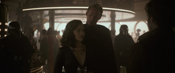Movie still from “Solo: A Star Wars Story” (2018), directed by Ron Howard – A man and a woman standing next to each other; Medium shot, Over the shoulder angle