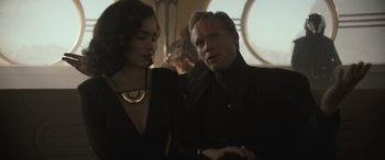 Movie still from “Solo: A Star Wars Story” (2018), directed by Ron Howard – A man and a woman are standing next to each other; Close Up shot, Over the shoulder angle