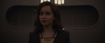 Movie still from “Solo: A Star Wars Story” (2018), directed by Ron Howard – A person wearing a necklace; Close Up shot, Over the shoulder angle