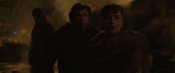 Movie still from “Solo: A Star Wars Story” (2018), directed by Ron Howard – A man and a woman standing next to each other; Medium shot, Low angle