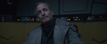 Movie still from “Solo: A Star Wars Story” (2018), directed by Ron Howard – A person sitting in front of a window; Close Up shot, Over the shoulder angle