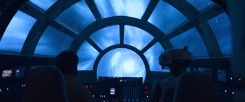 Movie still from “Solo: A Star Wars Story” (2018), directed by Ron Howard – The interior of a star wars ship at night time; Wide shot, Low angle