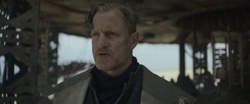 Movie still from “Solo: A Star Wars Story” (2018), directed by Ron Howard – A person wearing a jacket; Close Up shot, Low angle
