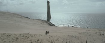 Movie still from “Solo: A Star Wars Story” (2018), directed by Ron Howard – People walking on the beach near the water; Extreme Wide shot, High angle