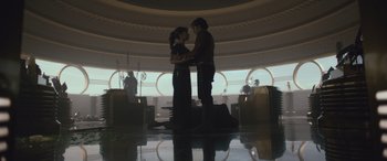 Movie still from “Solo: A Star Wars Story” (2018), directed by Ron Howard – A man and a woman standing next to each other; Wide shot, Low angle