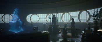 Movie still from “Solo: A Star Wars Story” (2018), directed by Ron Howard – A group of people standing in front of a large window; Extreme Wide shot, Low angle