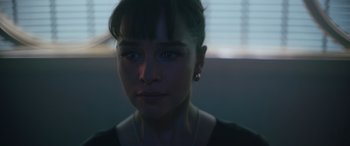 Movie still from “Solo: A Star Wars Story” (2018), directed by Ron Howard – A person wearing a black shirt; Close Up shot, Over the shoulder angle