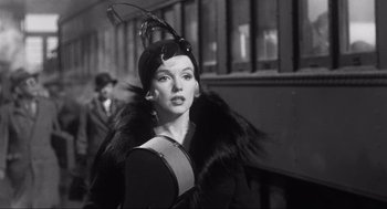 Movie still from “Some Like It Hot” (1959), directed by Billy Wilder – A black and white photo of a woman wearing a hat; Close Up shot, Low angle