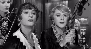 Movie still from “Some Like It Hot” (1959), directed by Billy Wilder – A couple of women standing next to each other; Close Up shot, Low angle