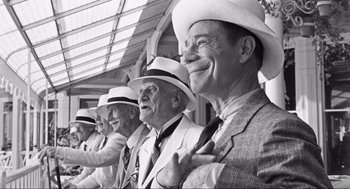 Movie still from “Some Like It Hot” (1959), directed by Billy Wilder – A black and white photo of a group of men wearing hats; Medium shot, Low angle