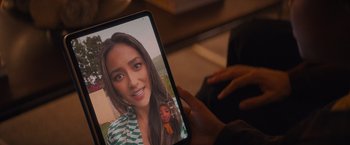 Movie still from “Something from Tiffany's” (2022), directed by Daryl Wein – A person is holding a tablet in their hand; Extreme Close Up shot, High angle