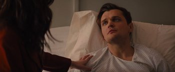 Movie still from “Something from Tiffany's” (2022), directed by Daryl Wein – A man in a hospital bed with a woman; Close Up shot, Over the shoulder angle