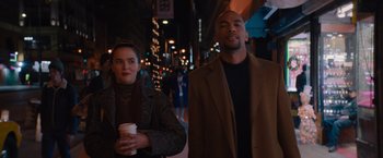 Movie still from “Something from Tiffany's” (2022), directed by Daryl Wein – A man and a woman walking down a street at night; Medium shot, Low angle