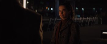 Movie still from “Something from Tiffany's” (2022), directed by Daryl Wein – A woman in a brown coat talking to a man; Medium shot, Over the shoulder angle