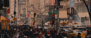 Movie still from “Something from Tiffany's” (2022), directed by Daryl Wein – A crowd of people walking down a busy street; Extreme Wide shot, High angle