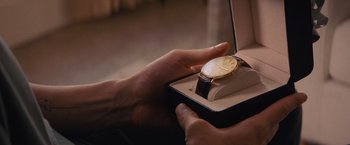 Movie still from “Something from Tiffany's” (2022), directed by Daryl Wein – A person holding a watch in a box; Extreme Close Up shot, High angle