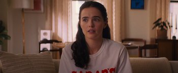 Movie still from “Something from Tiffany's” (2022), directed by Daryl Wein – A person sitting in a room near a window; Close Up shot, Over the shoulder angle