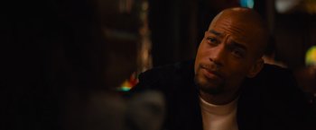 Movie still from “Something from Tiffany's” (2022), directed by Daryl Wein – A person wearing a black jacket; Close Up shot, Over the shoulder angle